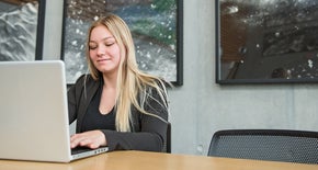Woman sitting at her laptop
